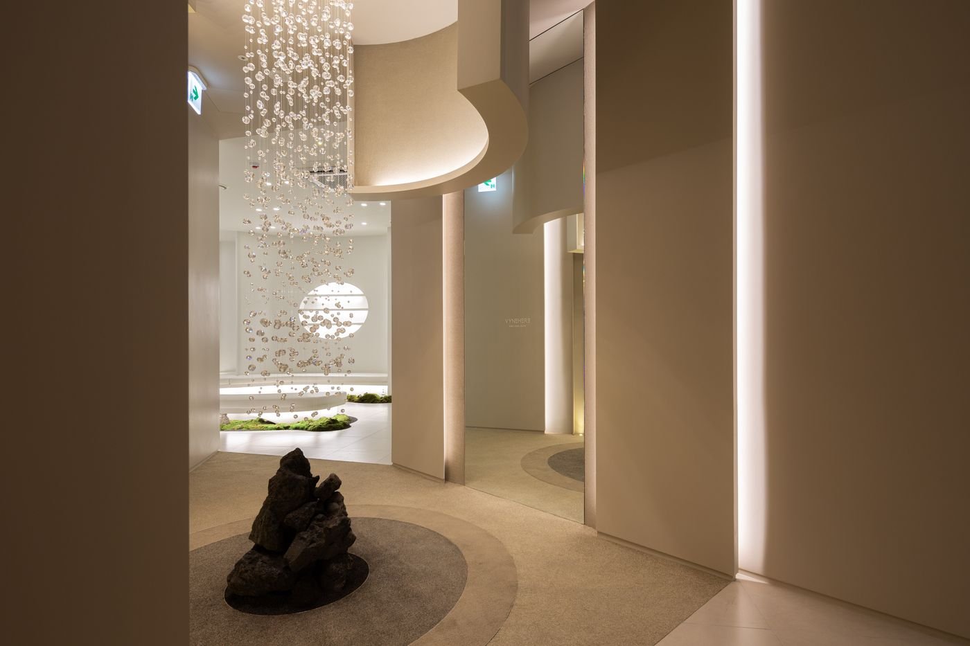 The atrium at Vyneherb Clinic, with a stone set under a chandelier