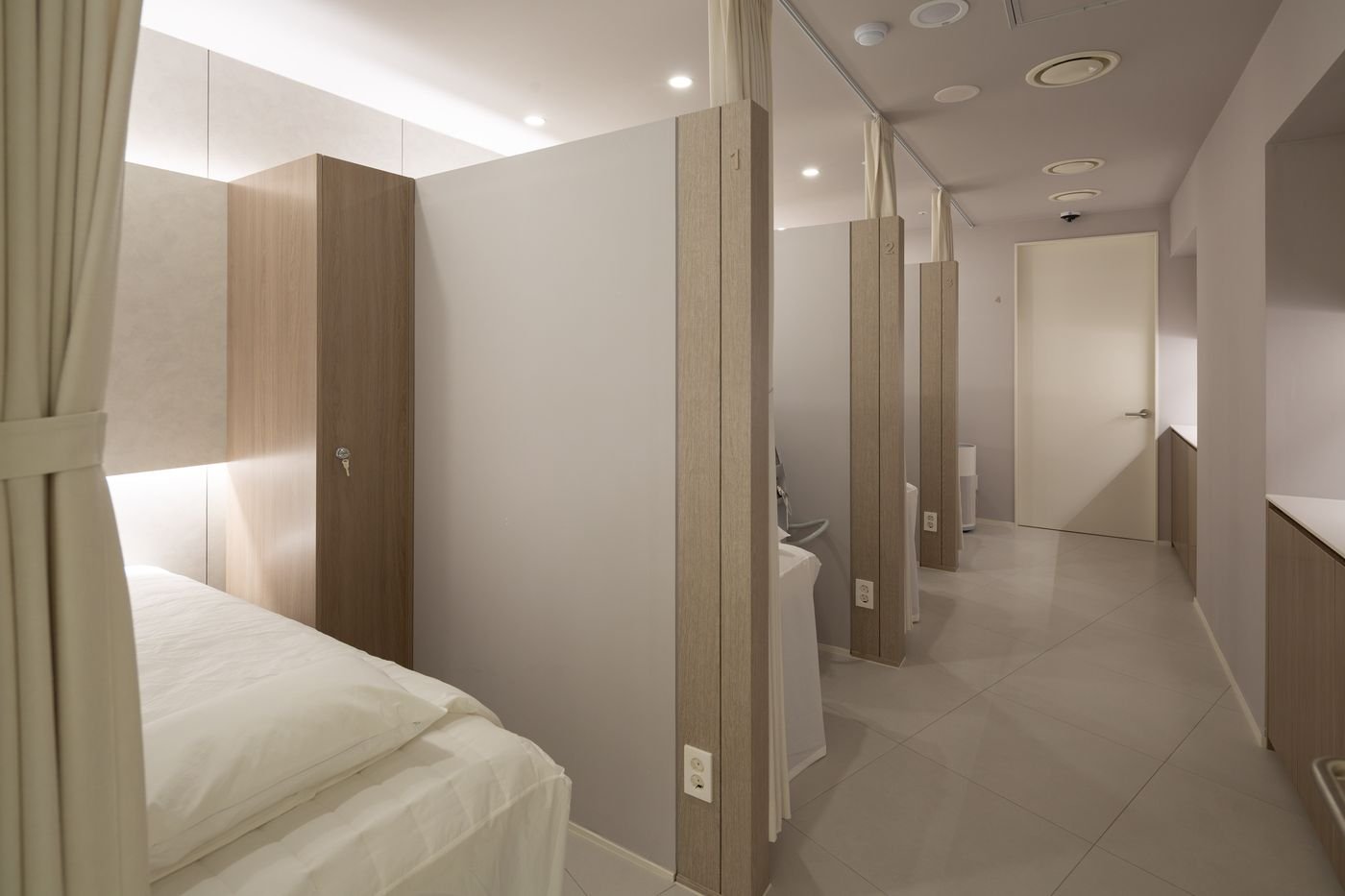 Curtained treatment bays at Vyneherb Clinic